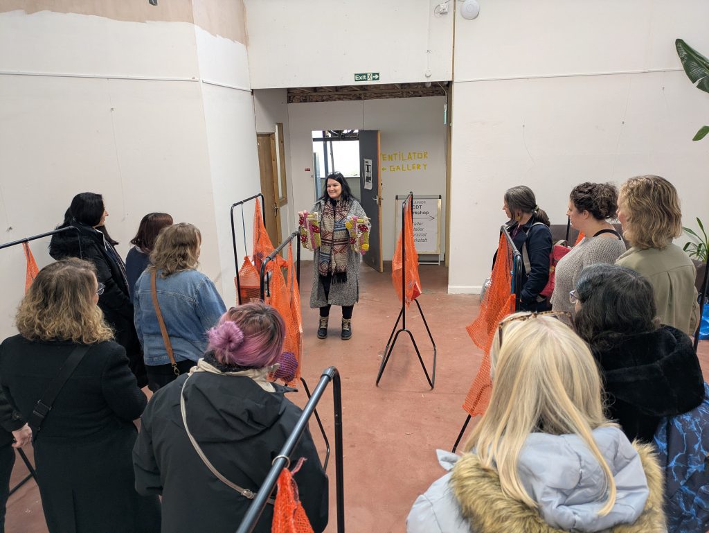 Sarmite running an art workshop upstairs