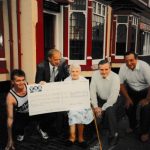 Danny Ryan (left) outside the Crown Pub Balsall Heath with a giant cheque