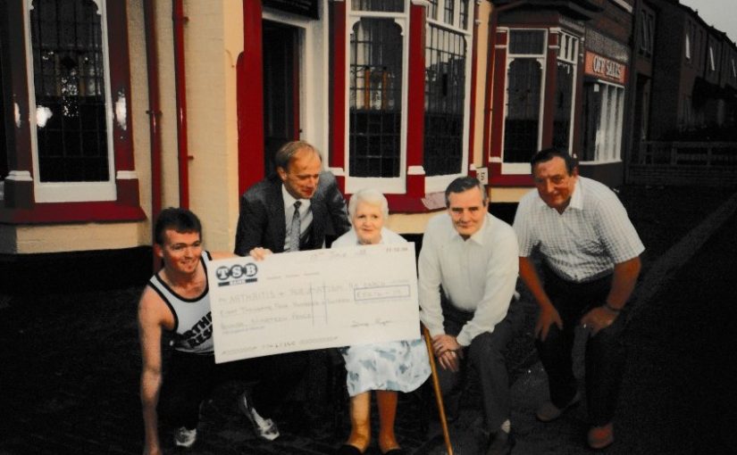 Danny Ryan (left) outside the Crown Pub Balsall Heath with a giant cheque