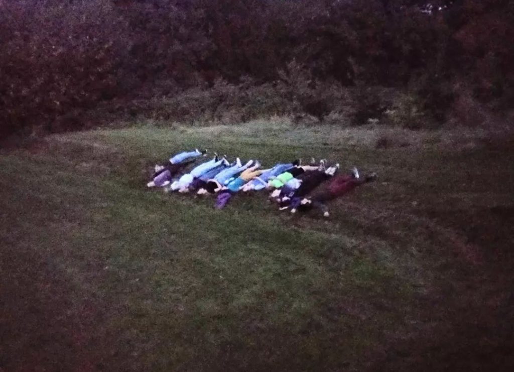 Venturers from Woodcraft Folk look up to the sky in Highbury Park 2021